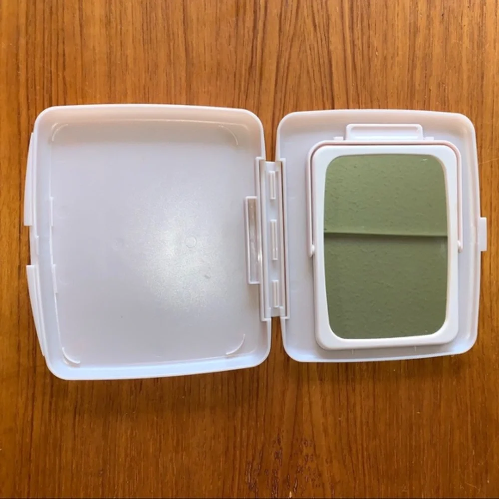 Mary Kay pink plastic compact travel mirror.